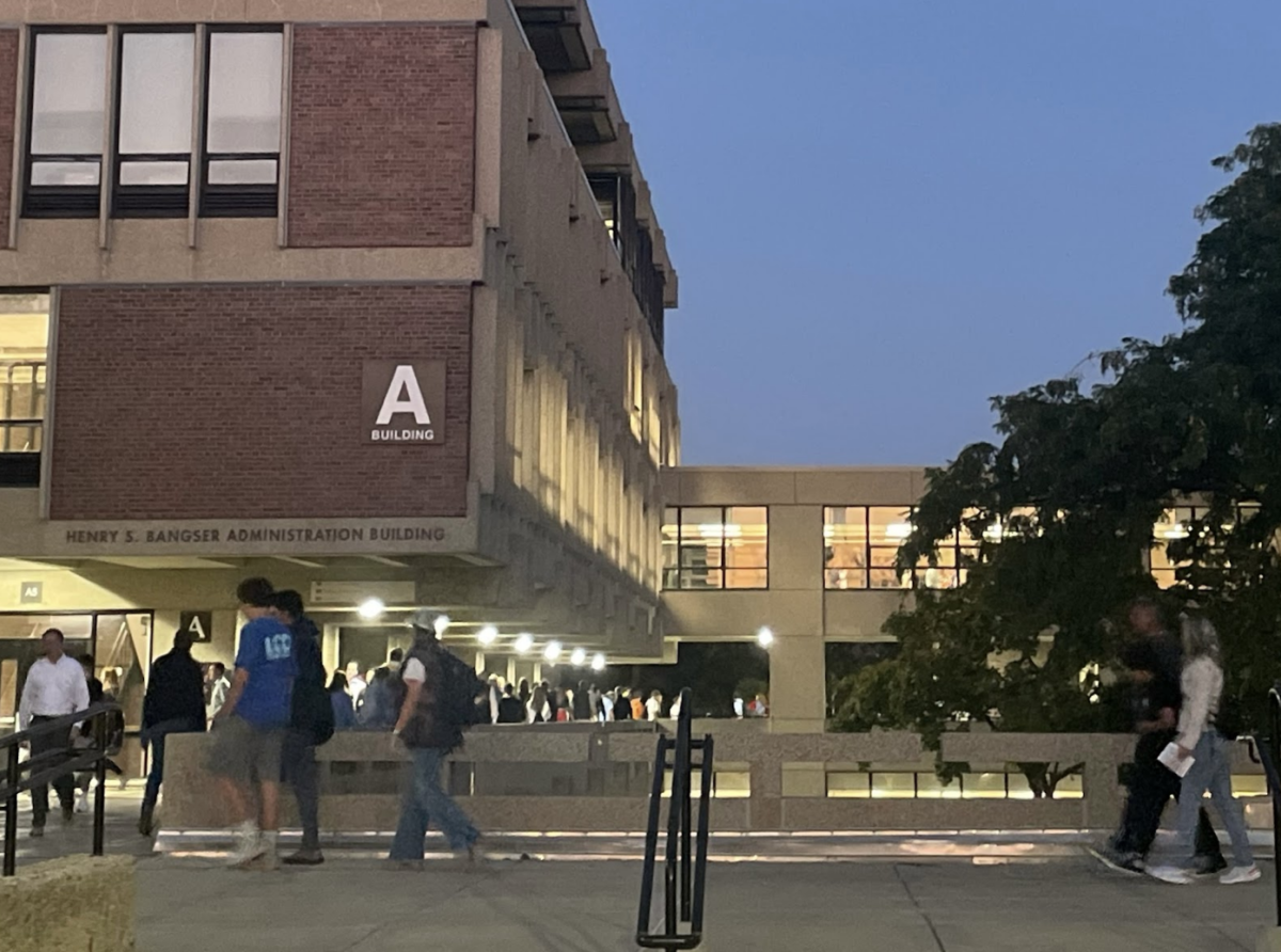 Freshmen and their guardians walk to their next class at Freshmen Go to School Night 